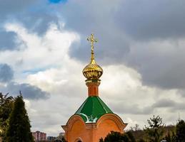 Christian church cross in high steeple tower for prayer photo