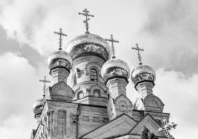 Christian church cross in high steeple tower for prayer photo