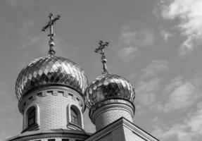 Christian church cross in high steeple tower for prayer photo