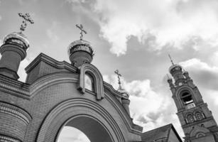 Christian church cross in high steeple tower for prayer photo