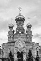 Christian church cross in high steeple tower for prayer photo