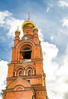 Christian church cross in high steeple tower for prayer photo