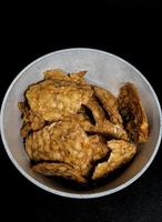 This is a close up photo of tempe chips in a small bowl.