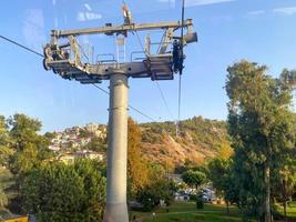 Modern beautiful cable car, lift, funicular in the mountains on vacation in a warm tropical eastern paradise country southern resort photo