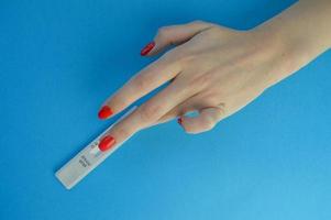 Positive test result by using rapid test for COVID-19, quick fast antibody point of care testing. Lab performing rapid diagnostic test for antibodies to detect presence of antigens COVID-19 disease photo