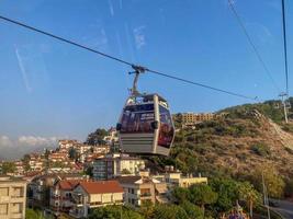Modern beautiful cable car, lift, funicular in the mountains on vacation in a warm tropical eastern paradise country southern resort photo