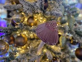 Christmas toy on a tree branch and Garland photo