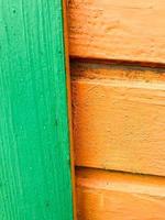 Texture of wooden boards of yellow and green with seams horizontally painted with natural paint. The background photo