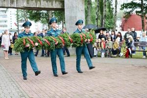 Men military and old man grandfather veteran of the Second World War in medals and decorations lay wreaths, salute on the day of victory Moscow, Russia, 05.09.2018 photo