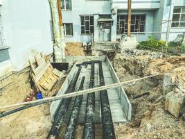 black, polypropylene, long pipes are laid underground for communications. laying pipes for plumbing of residential buildings photo