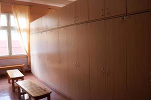 Room, locker room for workers with individual lockers for changing clothes in an industrial plant photo