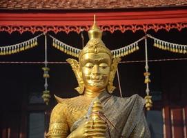 Thao Werasuwan gold color at Chulamani Temple, Samut Songkhram Province. Thailand photo