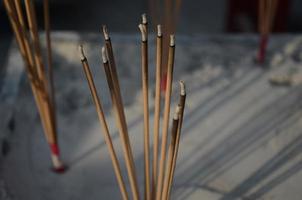 Burning incense sticks. Incense for praying Buddha or Hindu gods to show worship. photo