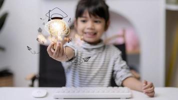 Creative idea, bright thinking, education, knowledge cognition. Portrait smart clever curious girl child with glowing lamp in hand photo