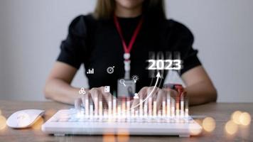 Business and Technology target set goals and achievement in 2023 new year resolution statistics graph rising revenue, planning to start up strategy, icon concept photo