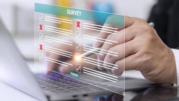 Survey form concept. Check marks on checklist and Filling online form or answering questions. Customer Experiences and satisfaction concept. photo