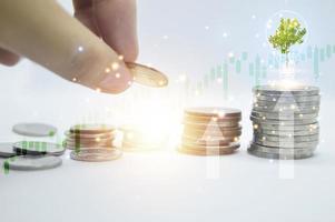 hands stacking coins on white background, concept business success photo