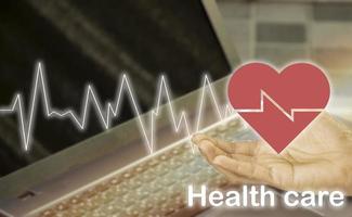 red hand and heart icon, health care concept photo