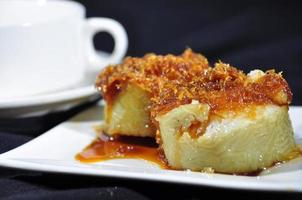 Lopis cake made of sticky rice topped with brown sugar and coconut photo