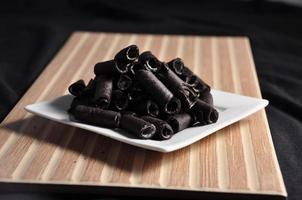 Vanilla wafer sticks on a plate photo