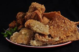 various fried foods, made from tempeh, tofu, bakwan, banana and sweet potato photo