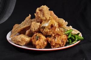 various fried foods, made from tempeh, tofu, bakwan, banana and sweet potato photo