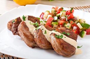 Pork medallions with salsa photo