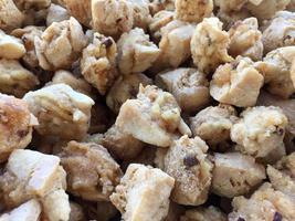 pile of crispy fried tofu at a street food vendor's stall photo