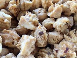 pile of crispy fried tofu at a street food vendor's stall photo
