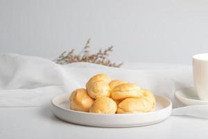 Fresh milk eclair in white plate photo