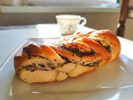 Bun with poppy seeds photo