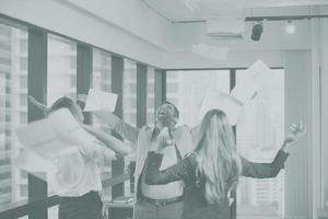 Happiest moment, Joyful Office people success finish job throwing papers with mono tone for background photo