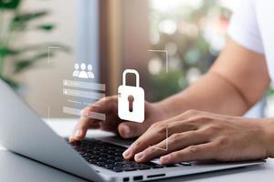 Cybersecurity and privacy concepts to protect data. Lock icon and internet network security technology. Businessmen protecting personal data on laptop and virtual interfaces. photo
