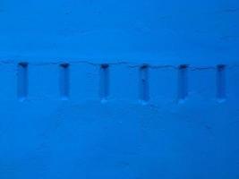 Six parallel lines. Short lines. Azure wall. Put your text here photo