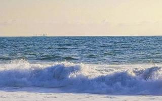 Extremely huge big surfer waves at beach Puerto Escondido Mexico. photo