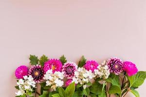 autumn flower arrangement. border of asters, dahlias and hydrangeas. top view. beige background. space for text. photo