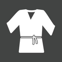icono invertido del glifo de la túnica de karate vector