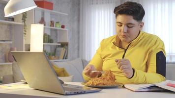 Obese child enjoying food. Obesity problem. Overweight child eating pasta, very happy and enjoying. video