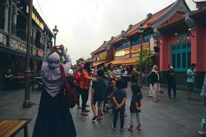 Tangerang, West Java, Indonesia, 2022 - Visitors hanging out at the PIK Chinatown Pantjoran Area. photo