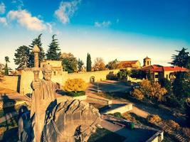 Telavi, Georgia, 2022 - Aerial close up Monument of king Erekle II . Beautiful view of Kakheti landscape from Telavi. Alazani valley and red roof houses in Kakheti photo