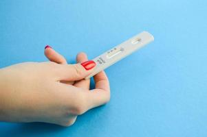 Positive test result by using rapid test for COVID-19, quick fast antibody point of care testing. Lab performing rapid diagnostic test for antibodies to detect presence of antigens COVID-19 disease photo