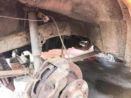 Old rusty worn brake discs, pads of a truck, car. Car suspension repair. Replacing wheel photo