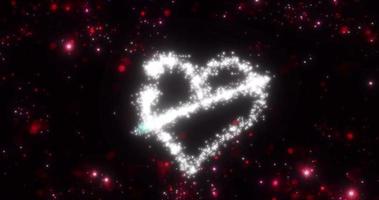 un coeur d'un salut de comète volante et l'inscription amour de particules et de lignes d'or brillant lumineux sur fond rouge pour la saint-valentin. économiseur d'écran abstrait, vidéo en haute qualité 4k video