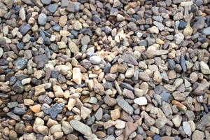 textura de piedra de guijarros pequeños para el fondo foto