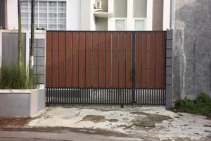 minimalist gate by sliding and pushing for a way to open it. photo