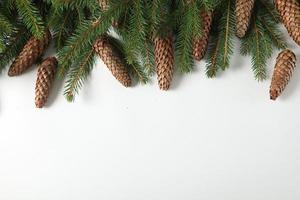 Holidays greeting card or banner composition with pine tree branches. Merry Christmas background and Happy New Year 2023. photo