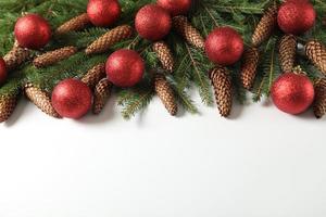 Holidays greeting card or banner composition with pine tree branches. Merry Christmas background and Happy New Year 2023. photo