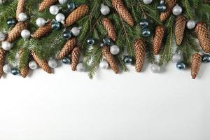 Holidays greeting card or banner composition with pine tree branches. Merry Christmas background and Happy New Year 2023. photo