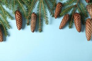 Holidays greeting card or banner composition with pine tree branches. Merry Christmas background and Happy New Year 2023. photo
