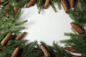 Holidays greeting card or banner composition with pine tree branches. Merry Christmas background and Happy New Year 2023. photo